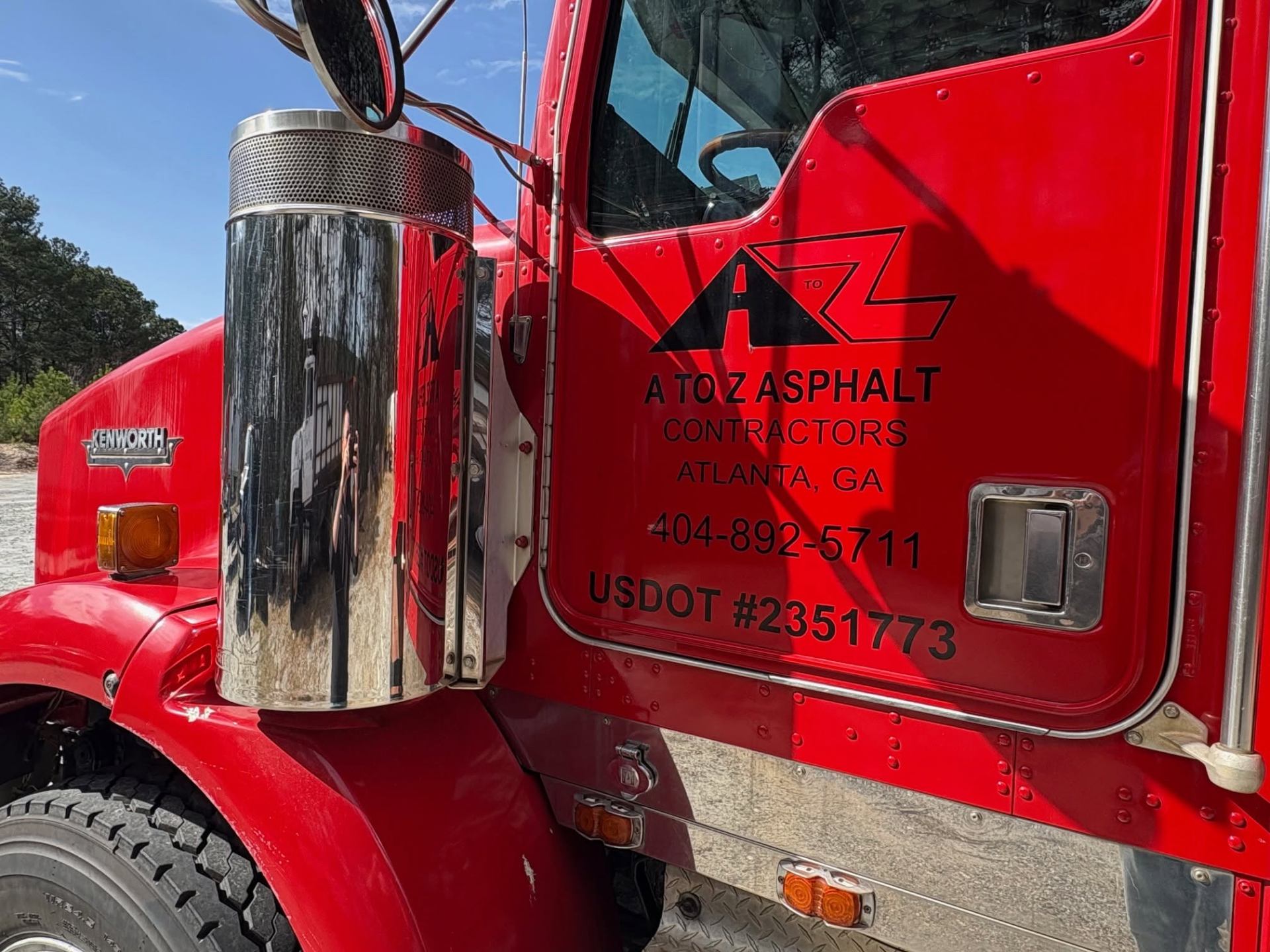 A to Z crew member operating an asphalt roller